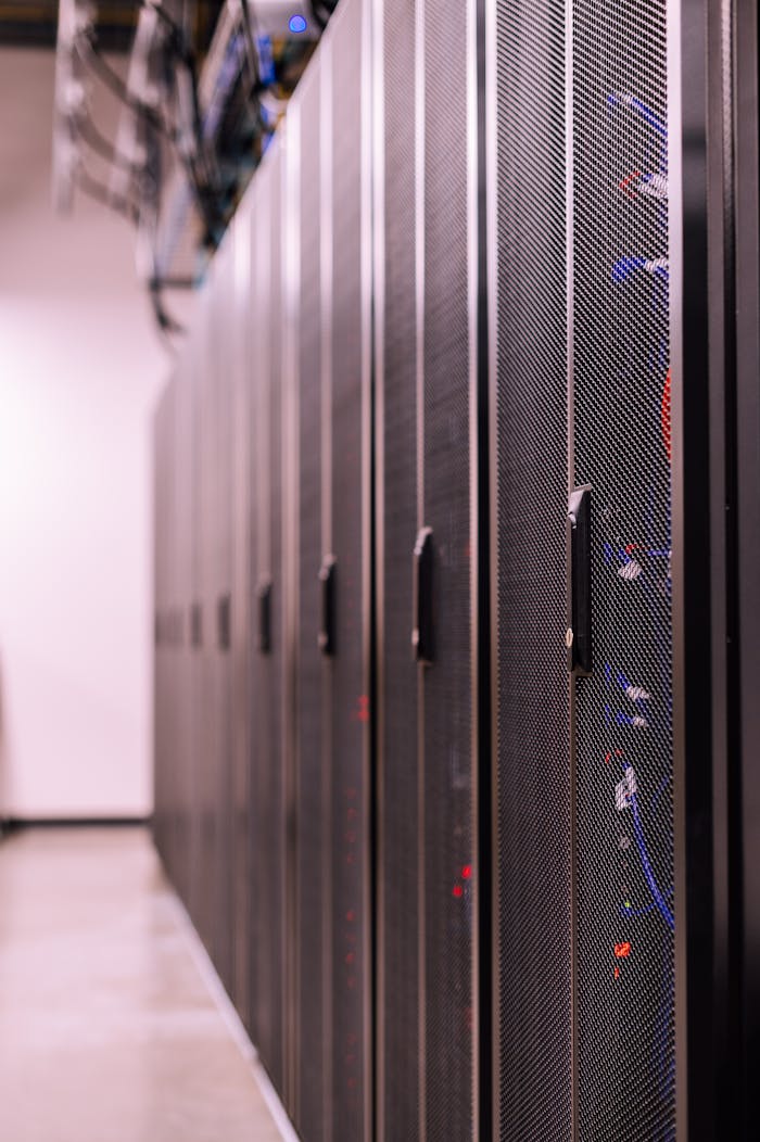our-story Detailed view of network server racks in a modern data center, highlighting technology infrastructure.